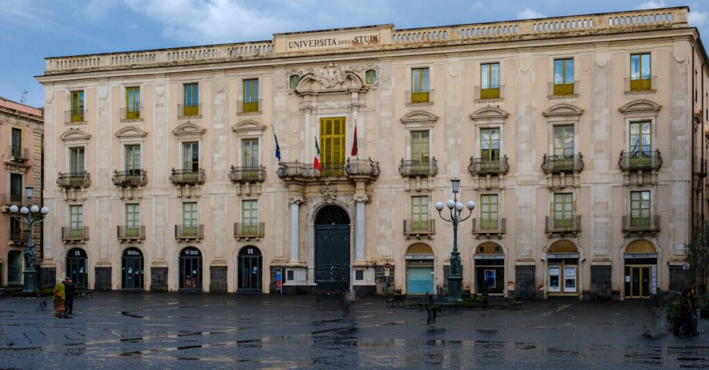 View of the historic university building in Catania, Sicily, showcasing neoclassical architecture.
